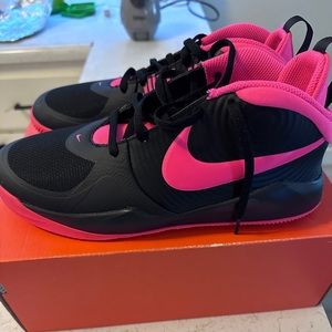 Nike Team Hustle sneakers in pink and black